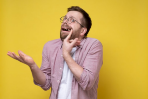 Man pointing to lost tooth and shrugging